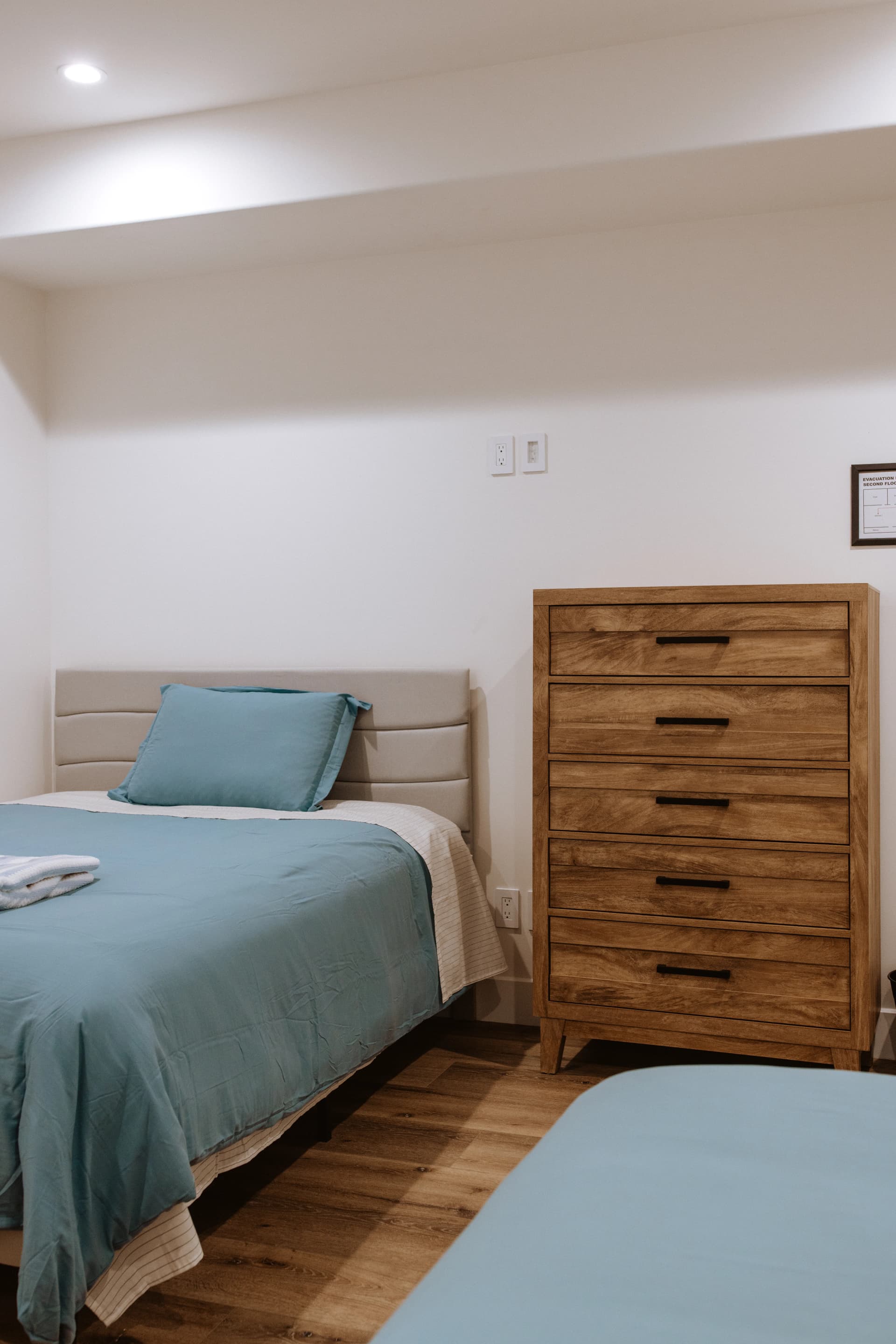 Private client bedroom at Double Peak Recovery with natural light and comfortable furnishings