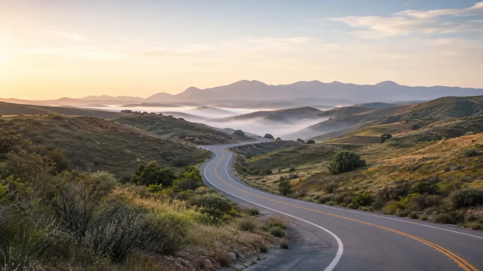 Road winding through misty North County hills near Vista, California